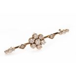 VICTORIAN DIAMOND BAR BROOCH set with a central old cushion cut diamond set cluster to a bar 49mm