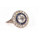 ART DECO DIAMOND AND SAPPHIRE TARGET RING the round bezel set with a central round brilliant cut