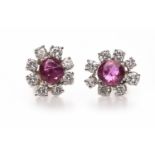 PAIR OF RUBY AND DIAMOND FLORAL CLUSTER EARRINGS one set with a ruby of approximately 0.