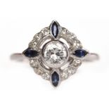 EARLY TWENTIETH CENTURY DIAMOND AND SAPPHIRE DRESS RING the pierced round bezel 14mm and set with a