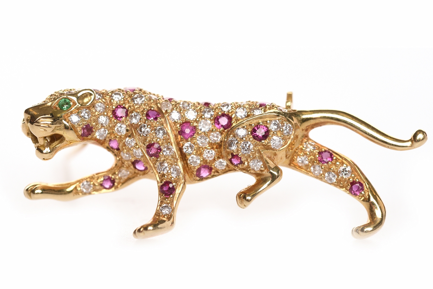 EIGHTEEN CARAT GOLD DIAMOND AND RUBY SET PANTHER MOTIF BROOCH the body of the panther with grain