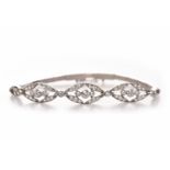 DIAMOND SET BRACELET formed by three marquise shaped sections each set with round brilliant cut