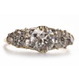 IMPRESSIVE VICTORIAN STYLE DIAMOND DRESS RING set with a central old cut diamond of approximately 1.