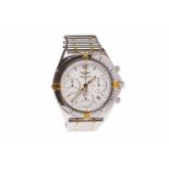 MID SIZE BREITLING STAINLESS STEEL AUTOMATIC CHRONOGRAPH WRIST WATCH the round white dial with