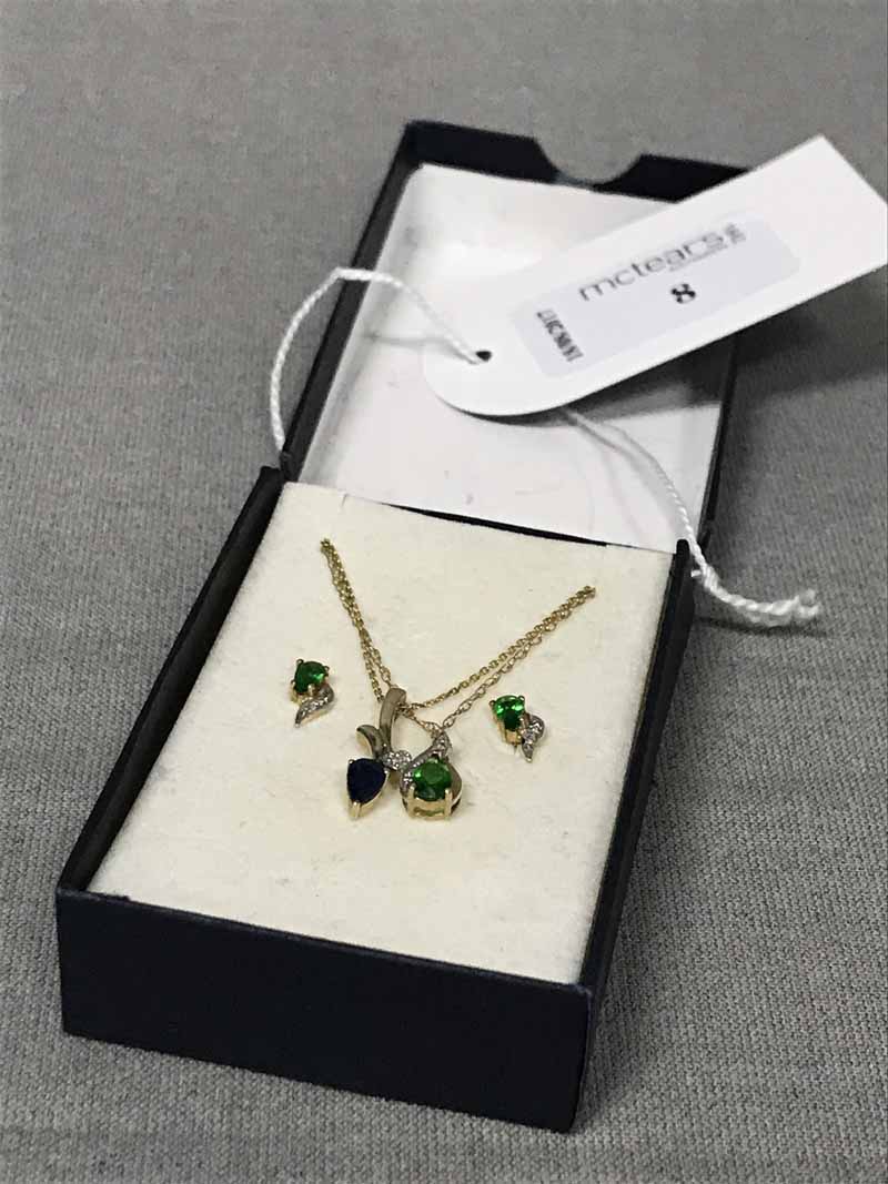 DIOPSIDE AND DIAMOND GOLD PENDANT AND EARRINGS along with a sapphire and diamond pendant on a gold