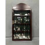 CASED COLLECTION OF SOUVENIR SPOONS from a wide variety of destinations in Europe and beyond