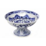 20TH CENTURY CHINESE BLUE AND WHITE PEDESTAL DISH with stylised designs, mark to base,