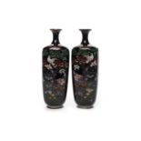 PAIR OF EARLY 20TH CENTURY JAPANESE ENAMEL VASES with trumpet neck and tapered squared body,