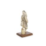 LATE 19TH/EARLY 20TH CENTURY JAPANESE IVORY OKIMONO modelled as a man with one foot raised on a