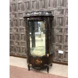 KINGSWOOD AND GILT METAL MOUNTED VITRINE OF SERPENTINE OUTLINE enclosed by shaped and glazed door