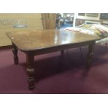 VICTORIAN OAK EXTENDING DINING TABLE with two additional leaves, on turned legs,