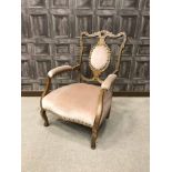 EDWARDIAN WALNUT OPEN ELBOW PARLOUR CHAIR with oval padded back, armrests and seat in pink draylon,