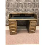 LATE VICTORIAN ROLL TOP DESK the low back with shutter front enclosing fitted interior,