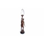 VICTORIAN BRONZED SPELTER LAMP in the form of Hermes holding aloft a clear glass shade,