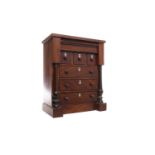 MAHOGANY MINIATURE CHEST in the form of a Victorian column chest, with secret frieze drawer,