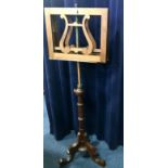 VICTORIAN MAHOGANY ADJUSTABLE DUET MUSIC STAND on a turned ringed tapering pillar,