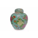 EARLY 20TH CENTURY CHINESE GINGER JAR WITH COVER painted with a bird of paradise and flowering