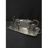 HAMMERED PEWTER COFFEE SET ON TRAY along with a group of brass items