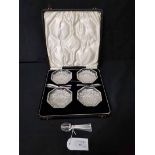 SET OF FOUR CRYSTAL BUTTER DISHES WITH SILVER KNIVES in a fitted case;