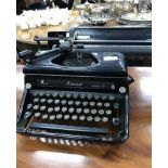 TWO PORTABLE SEWING MACHINES together with a typewriter