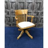 EARLY 20TH CENTURY OAK CAPTAIN'S CHAIR with reupholstered ivory leather chair pad
