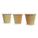 THREE ROYAL WORCESTER BLUSH IVORY PORCELAIN BASKETS each of tapering form, with gilt rims,