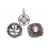 ROBERT ALLISON OF IONA SCOTTISH SILVER BROOCH set with a round purple paste, with celtic motifs,