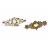 VICTORIAN NINE CARAT GOLD BAR BROOCH set with an oval citrine,