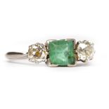 EARLY TWENTIETH CENTURY EMERALD AND DIAMOND THREE STONE RING the central square step cut emerald