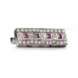 EARLY TWENTIETH CENTURY DIAMOND AND CREATED RUBY BROOCH of rectangular form,