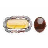 SCOTTISH AGATE AND QUARTZ SET BROOCH with a central rounded rectangular section of banded orange