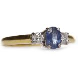 EIGHTEEN CARAT GOLD SAPPHIRE AND DIAMOND THREE STONE RING the central oval sapphire 5.