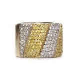 BROAD DIAMOND SET BAND with alternating sections of pave set yellow diamonds and white diamonds,