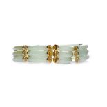 FOURTEEN CARAT GOLD GREEN HARDSTONE BRACELET with ribbed sections of green hardstone, 19cm long, 31.