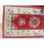 TWO SMALL CHINESE BORDERED RUGS