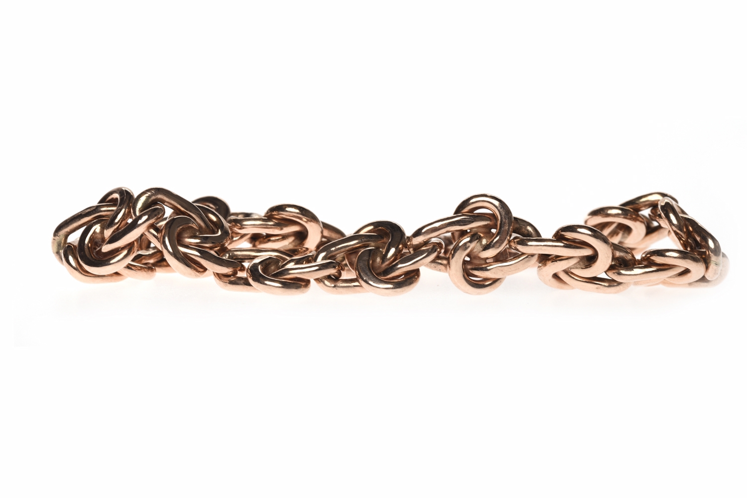 NINE CARAT ROSE GOLD BRACELET formed by knot motif links, 19cm long, 13.