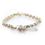 NINE CARAT GOLD VICTORIAN GATE BRACELET with an openwork heart shaped padlock clasp, 4.