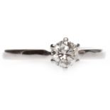 EIGHTEEN CARAT WHITE GOLD DIAMOND SOLITAIRE RING with a six claw set round brilliant cut diamond of