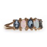 ROSE GOLD PLATED OPAL AND TOPAZ RING set with alternating oval gems, with spherical terminals,