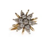 MID TWENTIETH CENTURY DIAMOND DRESS RING with a star motif bezel set with round diamonds,