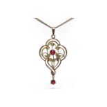 EDWARDIAN NINE CARAT GOLD SEED PEARL PENDANT of openwork design,