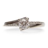 DIAMOND SOLITAIRE RING with a four claw set round brilliant cut diamond of approximately 0.