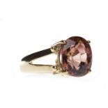 TOPAZ SINGLE STONE RING set with an oval dark pink to brown topaz 11.5x9.