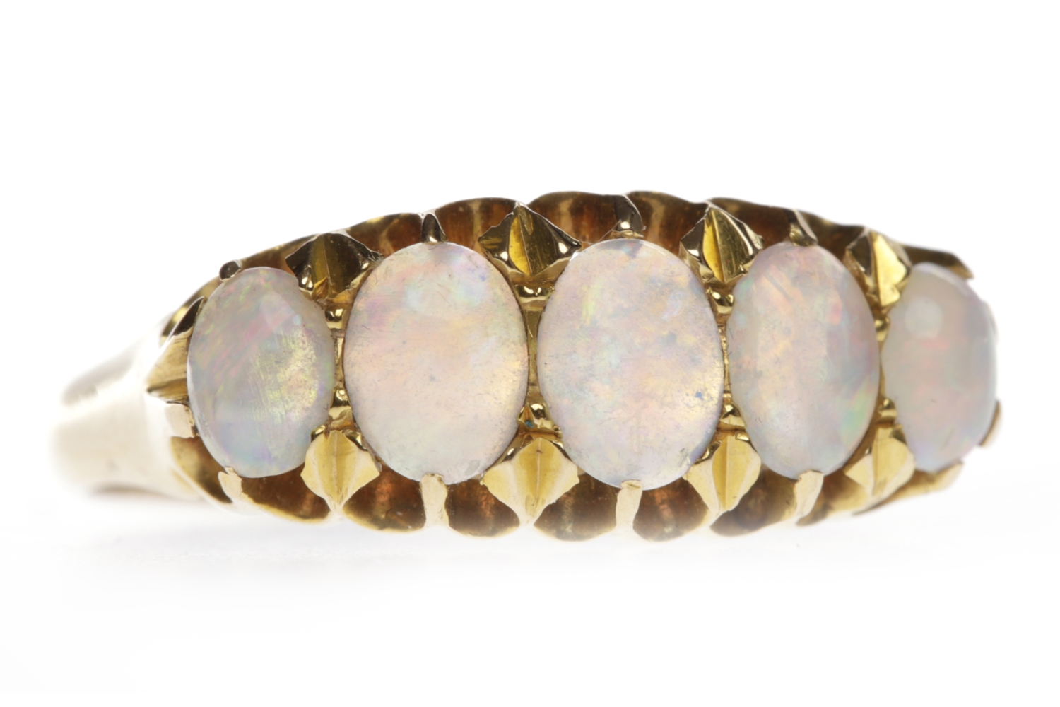 EARLY TWENTIETH CENTURY OPAL FIVE STONE RING set with graduated oval opals, the central opal 5.