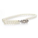 MIKIMOTO PEARL NECKLACE formed by a single strand of pearls, 39cm long,