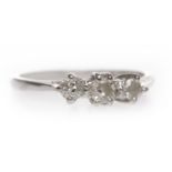 EIGHTEEN CARAT WHITE GOLD DIAMOND THREE STONE RING set with graduated round brilliant cut diamonds