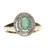 FOURTEEN CARAT GOLD EMERALD AND DIAMOND DRESS RING set with a central oval emerald 7mm long within
