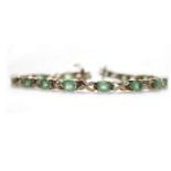 NINE CARAT GOLD EMERALD AND DIAMOND BRACELET set with oval emeralds each 5mm long and interspaced