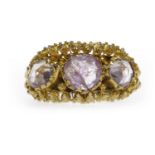 EARLY NINETEENTH CENTURY CONTINENTAL GEM SET RING the collet set purple stones within decorated