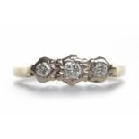 DIAMOND THREE STONE RING set with round brilliant cut stones totalling approximately 0.